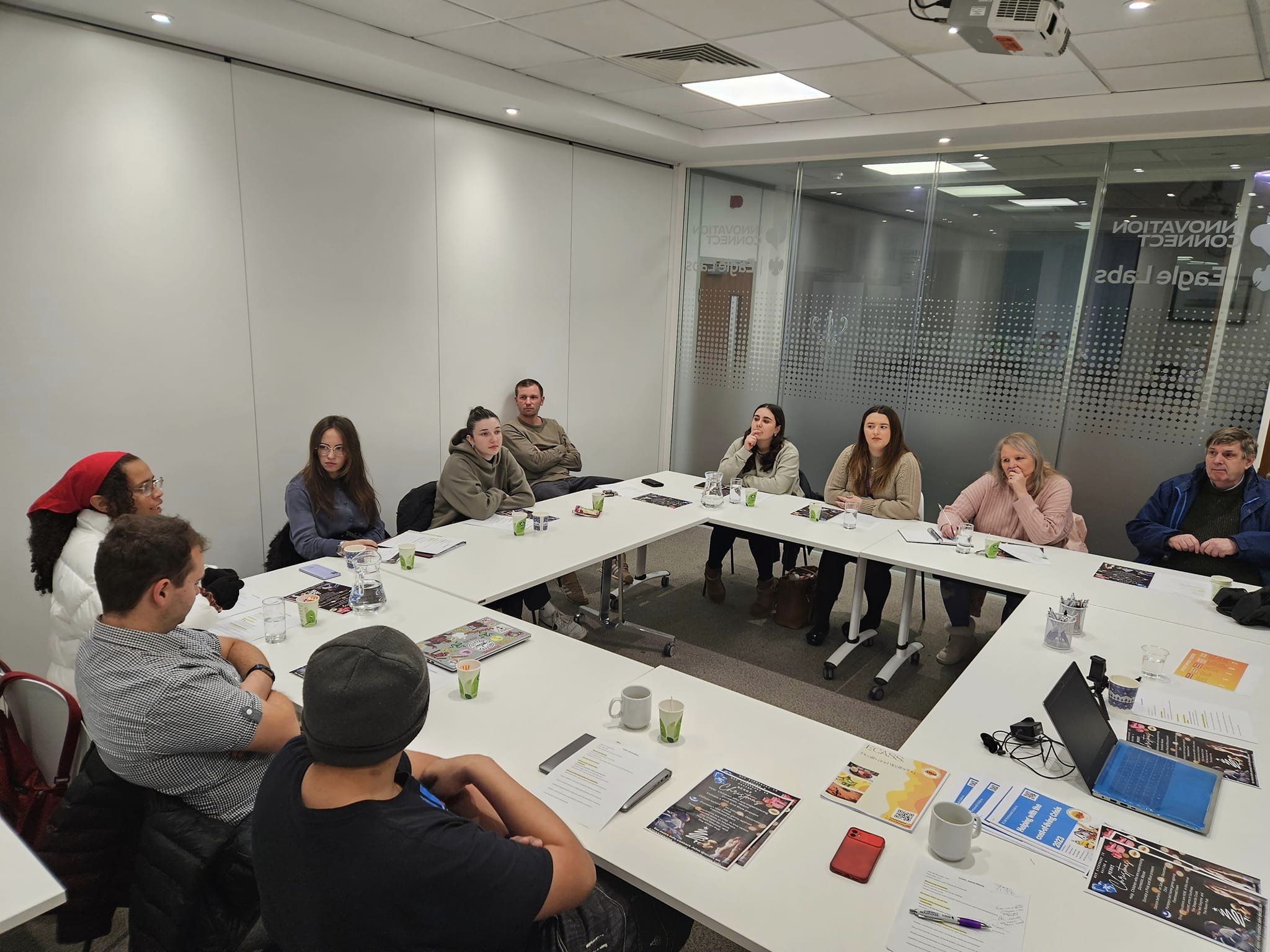 University of Portsmouth students and volunteers in a community project meeting